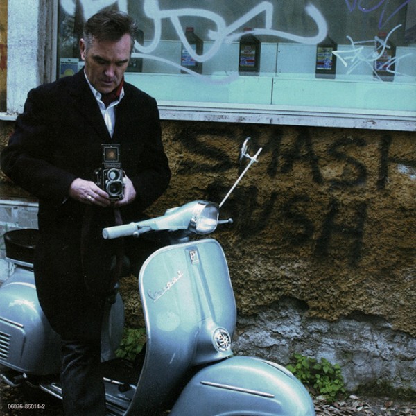 Morrissey with a Rolleiflex on a Vespa